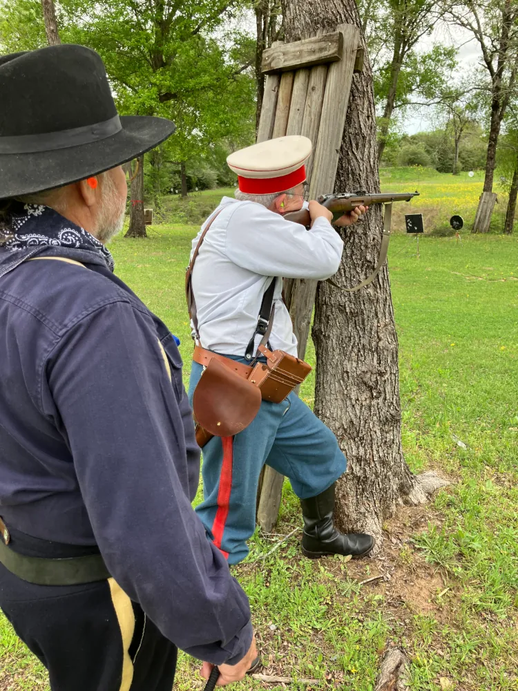 Participant with period-correct military surplus rifle and gear