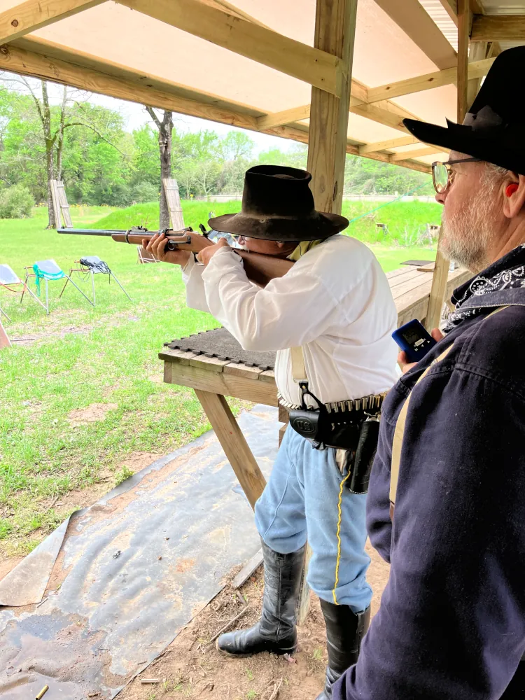 Participant with period-correct military surplus rifle and gear